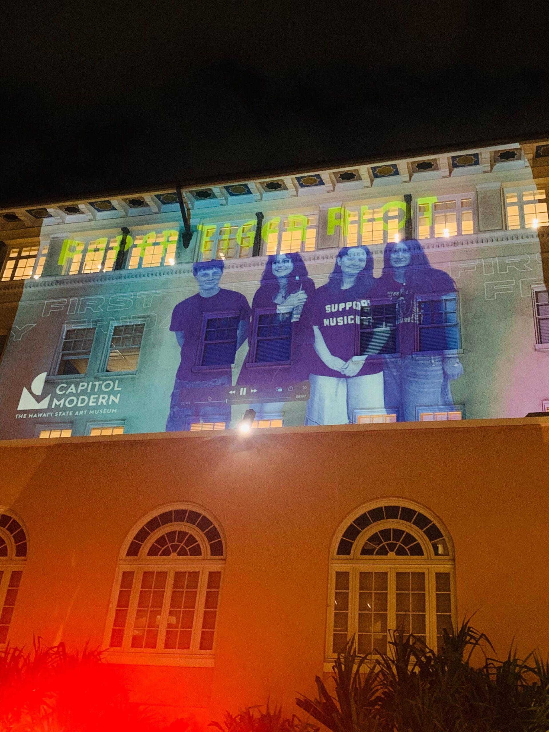 Paper Tiger Riot projected onto the wall at Capitol Modern
